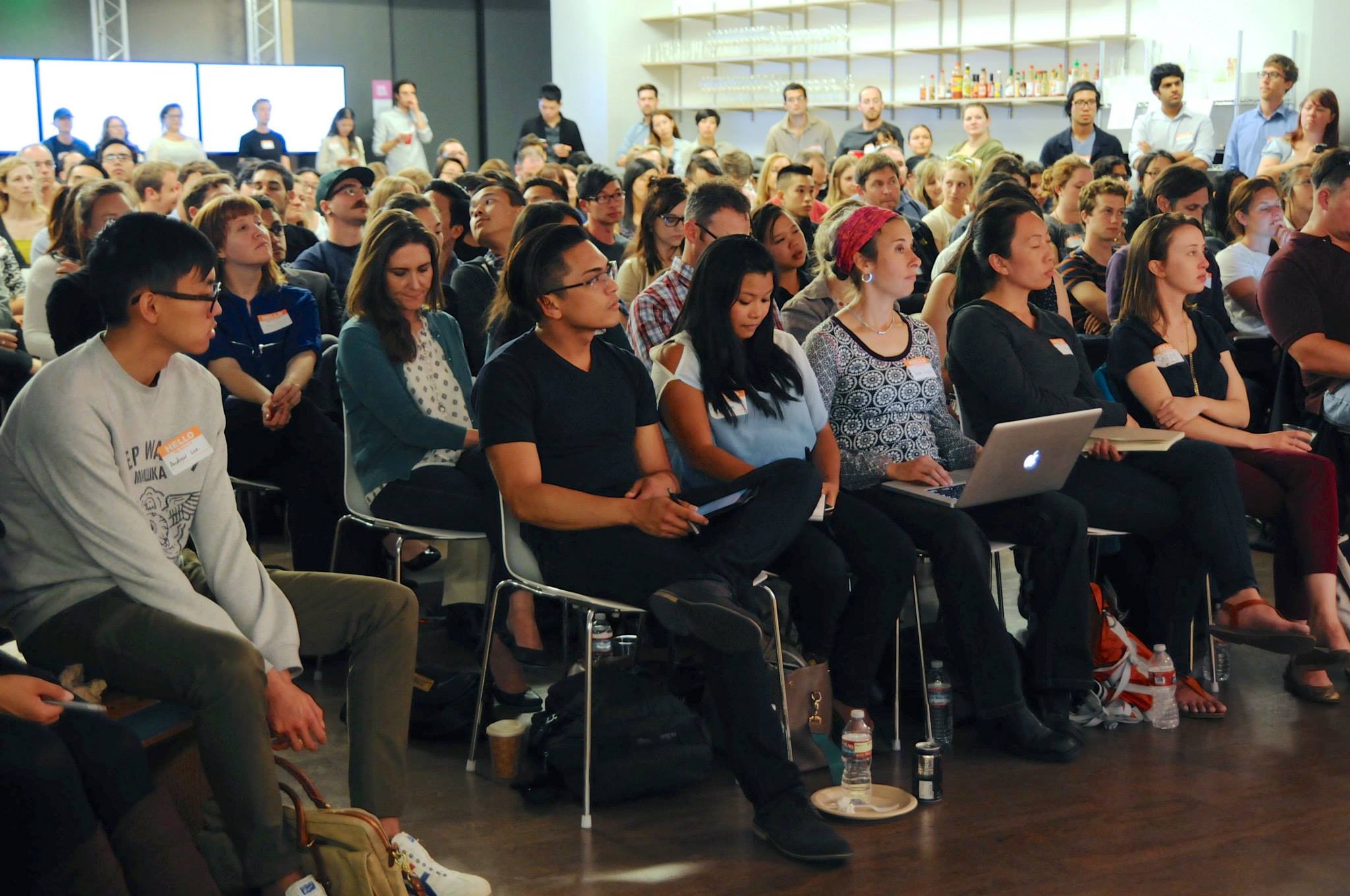 A packed audience of designers listening to a talk at a Cascade SF event