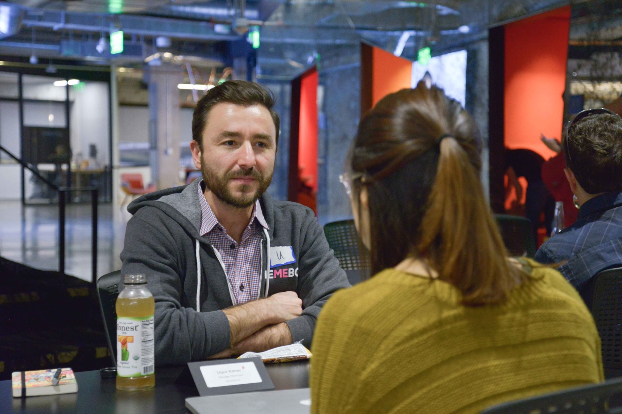 A design director listening during a one-on-one mentorship session
