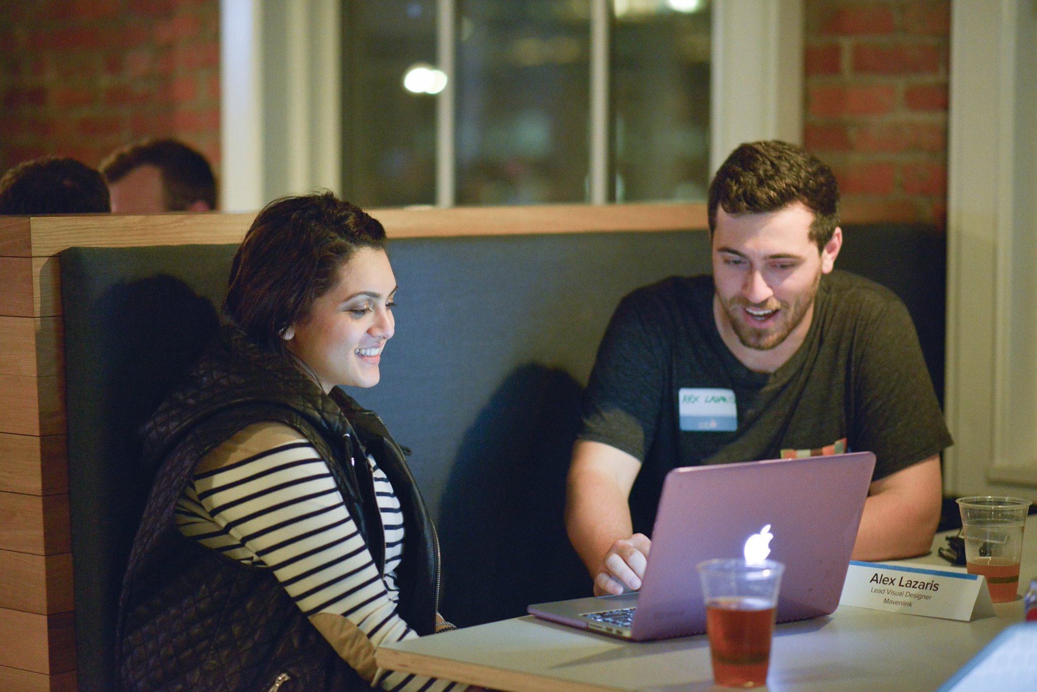 A product designer giving a founder feedback on their product at a Cascade SF mentor night