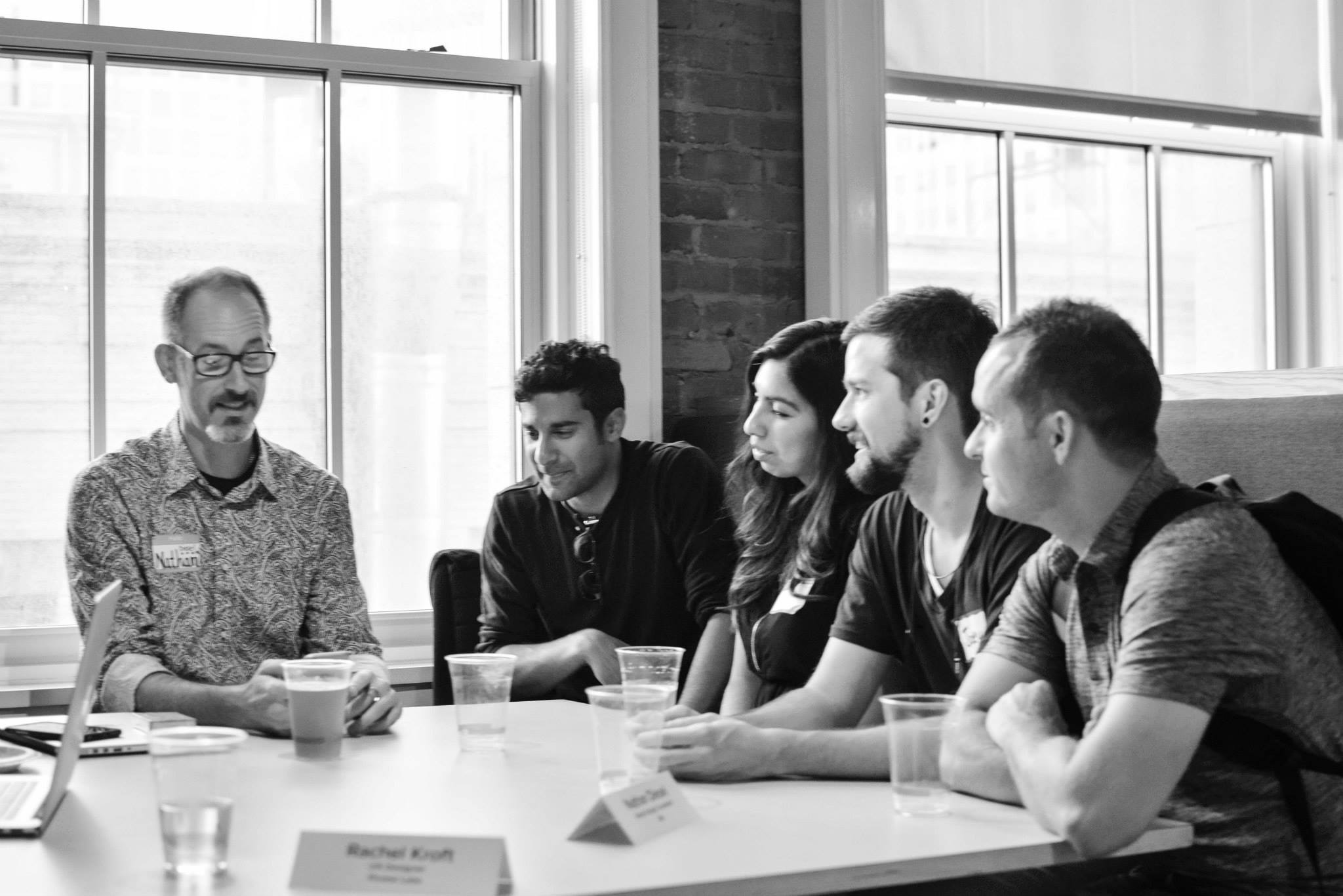 Designers working through a session together around a table